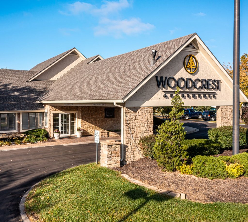 a building with the words woodcrest apartments on the outside.