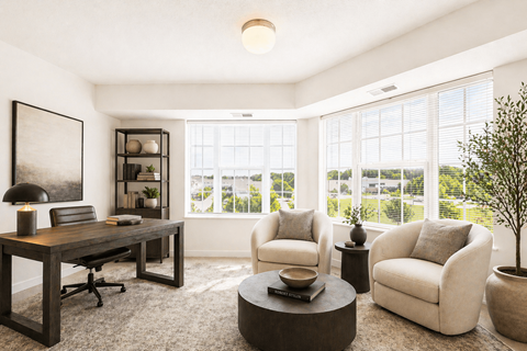 Home office with large windows and seating area at Lakewood Apartments, Lino Lakes, Minnesota