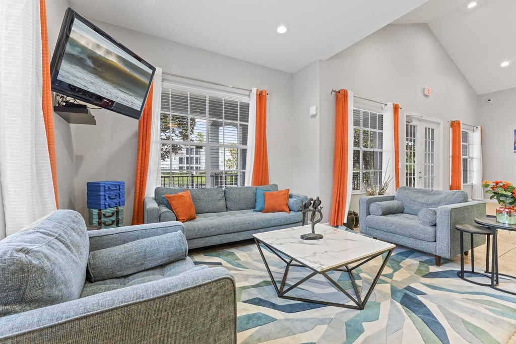 a living room with couches and chairs and a coffee table