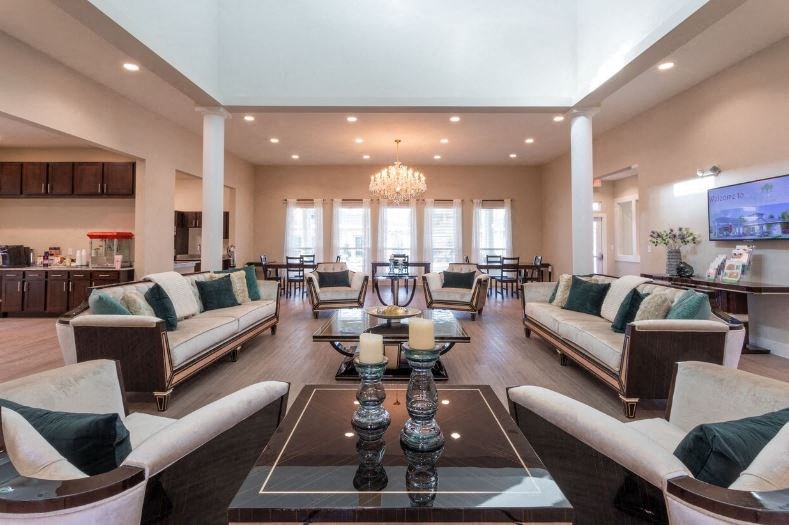 a large living room with couches and chairs and a table