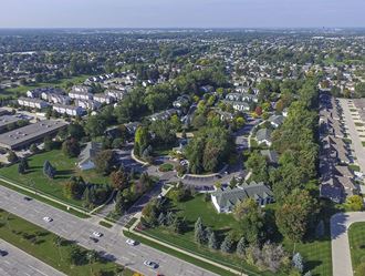 an aerial view of a neighborhood with houses and trees