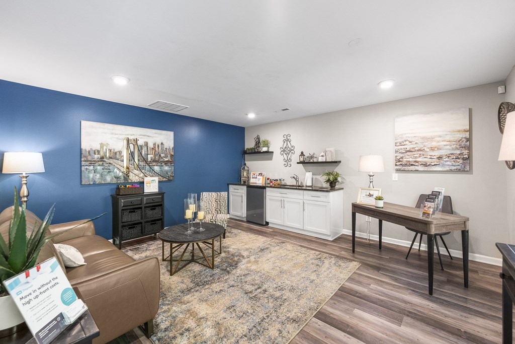 a living room with a blue accent wall and a couch