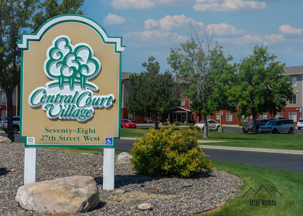 the sign for central court village in front of a street sign