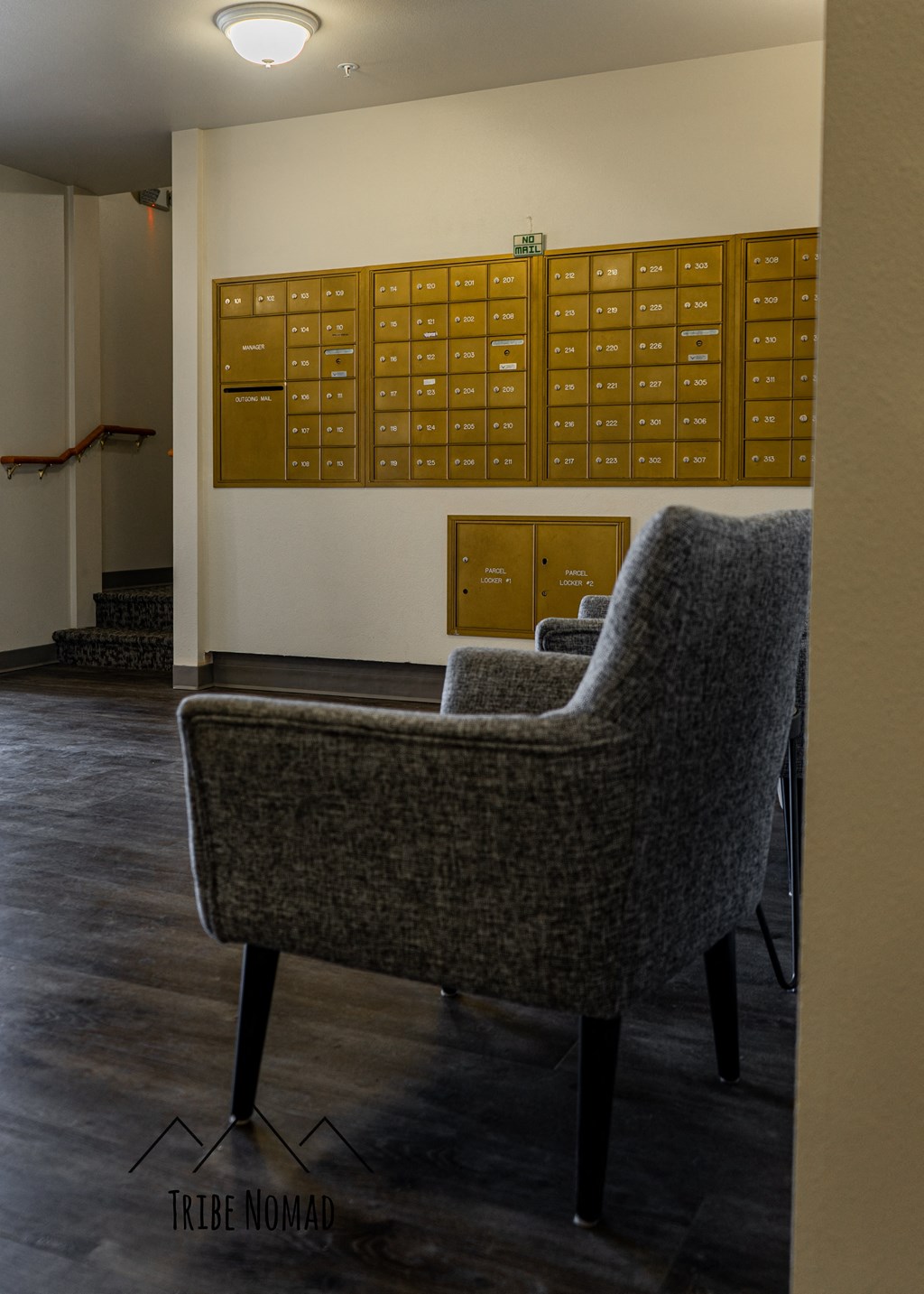 a chair in front of a wall of lockers in a room