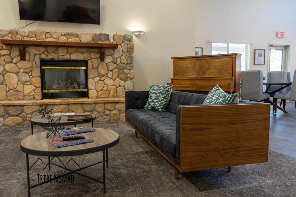 a living room with a couch and a fireplace