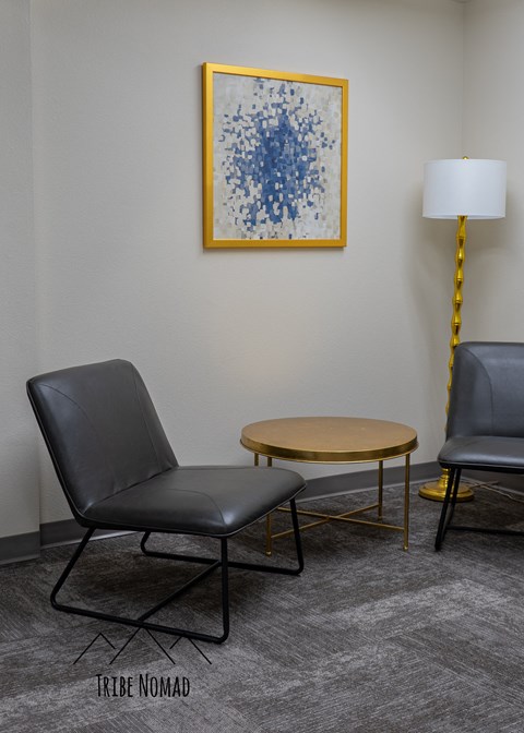 a living room with two chairs and a coffee table