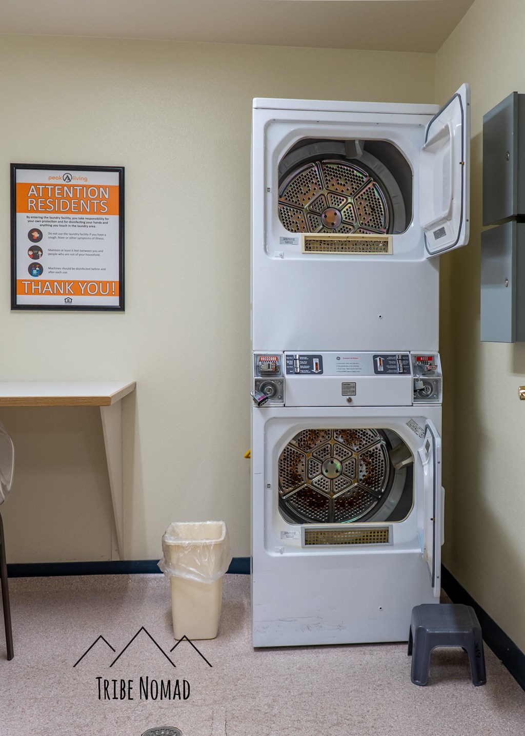a washer and dryer are stacked on top of each other in a room