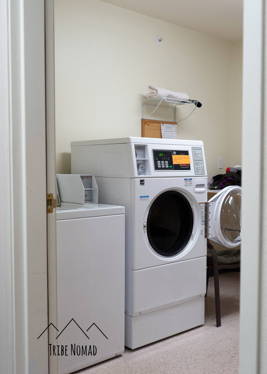a laundry room with a washing machine and a dryer