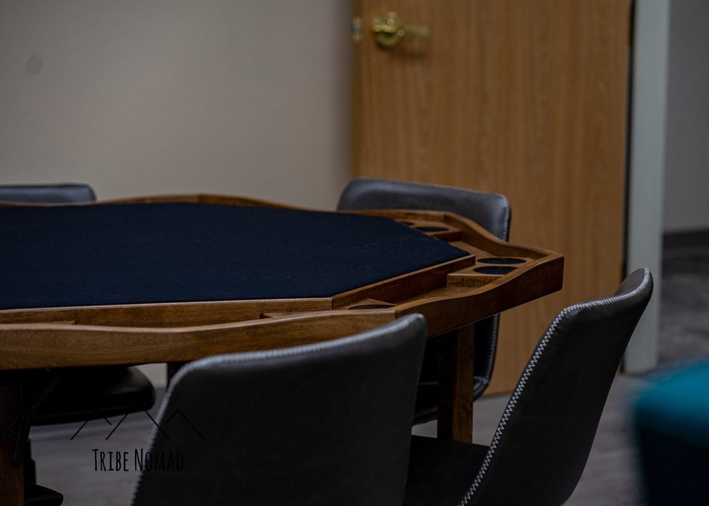 a table and chairs in a room with a door