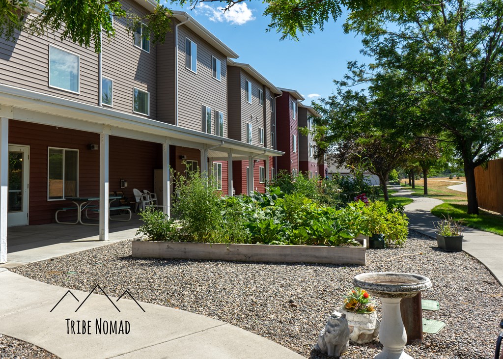 a courtyard with a fountain in front of an apartment building