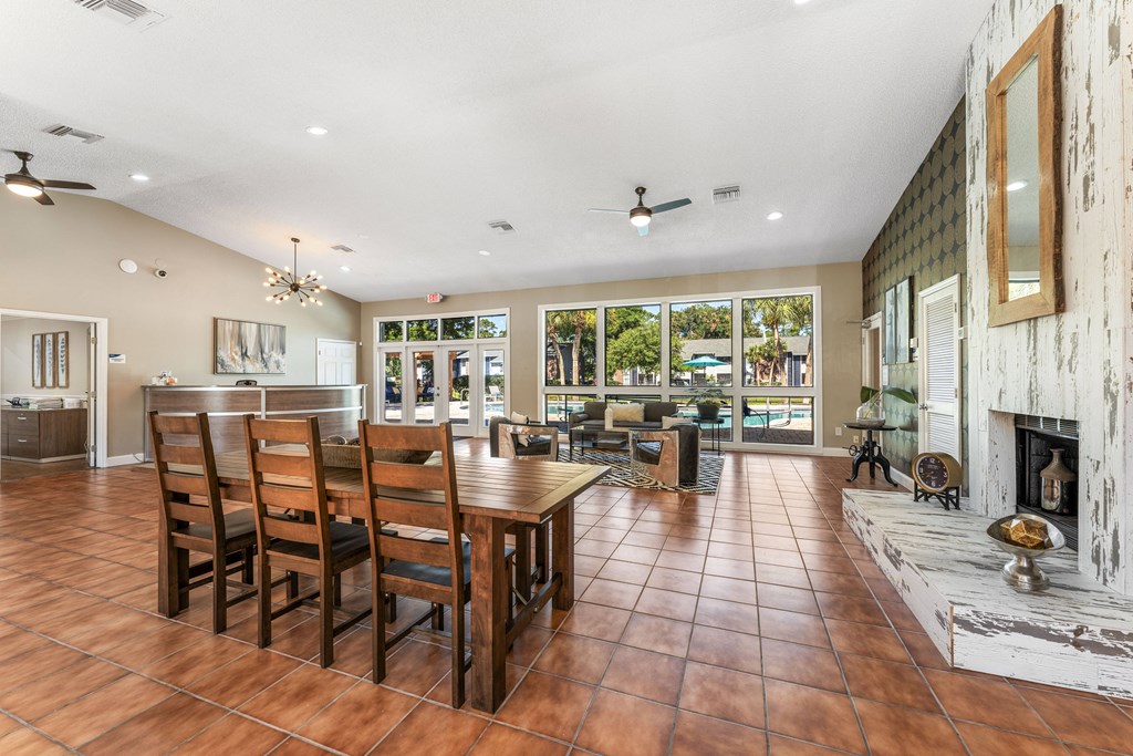 a dining room with a table and chairs and a fireplace