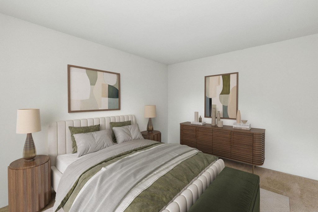 A bedroom with a large bed, a nightstand with a lamp, and a dresser with a mirror.