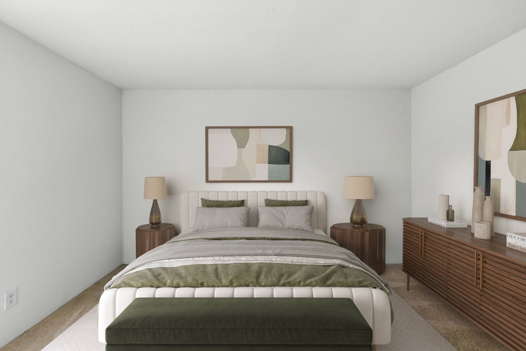 A bedroom with a large bed and a painting on the wall.