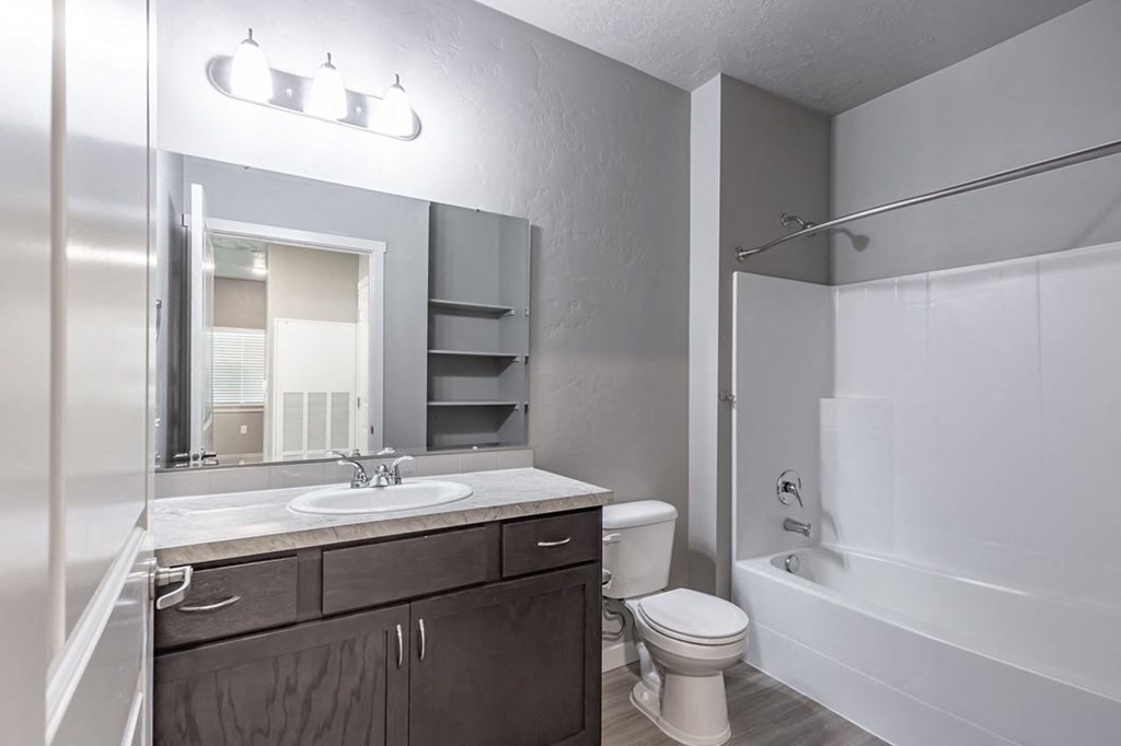 a bathroom with a toilet sink and bathtub