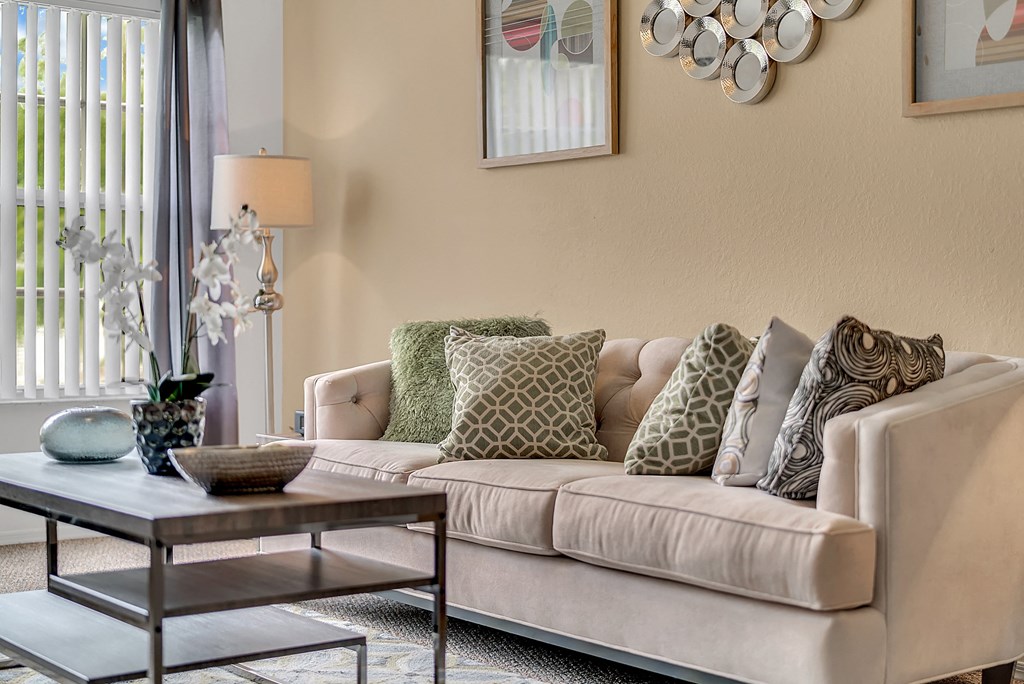 a living room with a couch and a coffee table