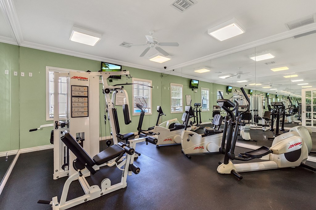 a gym with cardio machines and other exercise equipment