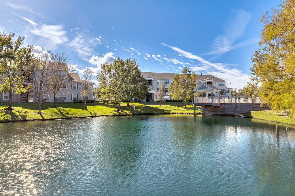 the view of a body of water with houses on the other side