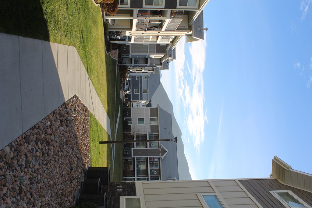 a view of the balconies of a building from the roof of another building