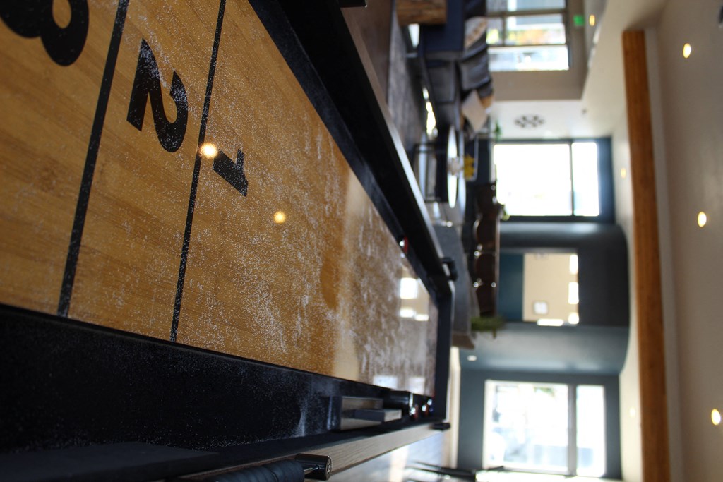 a view of the lobby of a building with a tv and stairs
