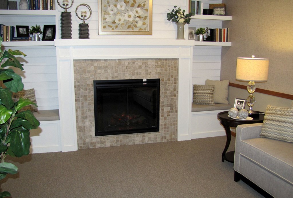 a living room with a fireplace and a couch