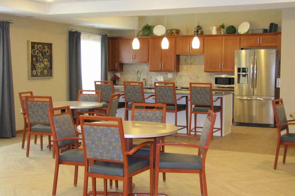 an open kitchen and dining area with a large table and chairs