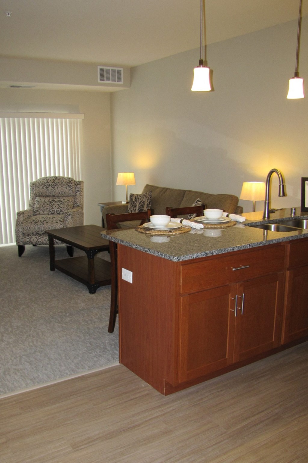 a view of the living room and kitchen from the dining room