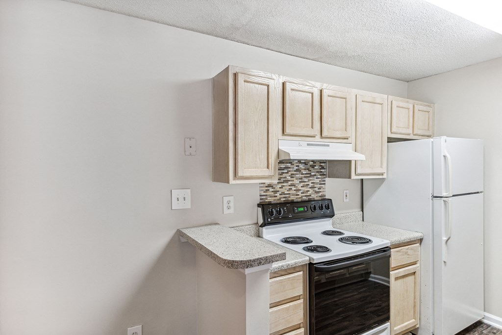 an overhead view of a kitchen with a stove and refrigerator