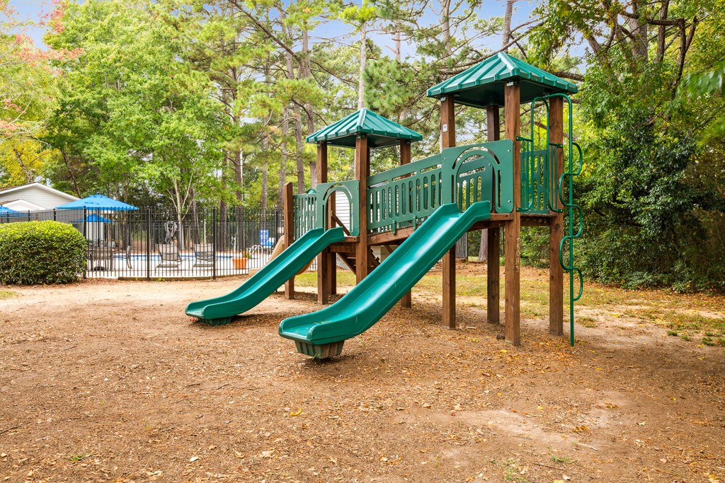 a playground with a slide at a park