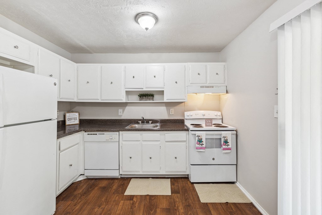 the preserve at ballantyne commons apartment kitchen with white cabinets and appliances
