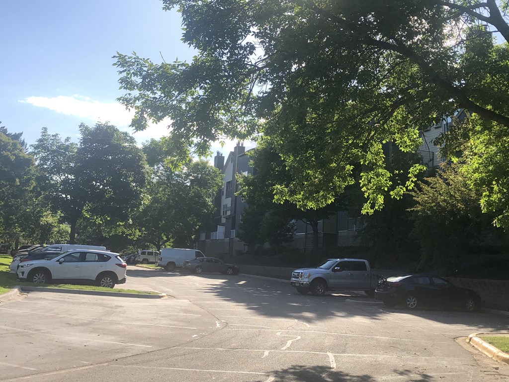 a parking lot in front of a church with cars parked