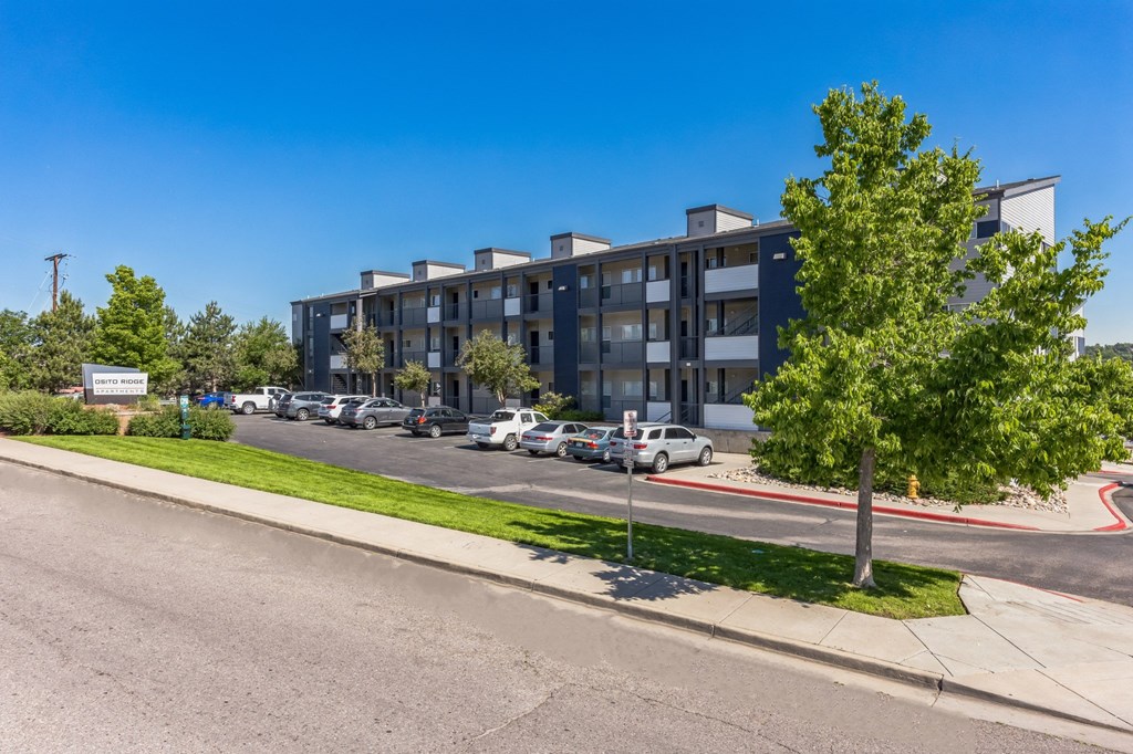 a view of an apartment building from the street