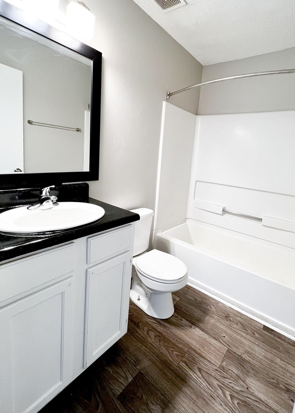 a bathroom with a toilet sink and bathtub