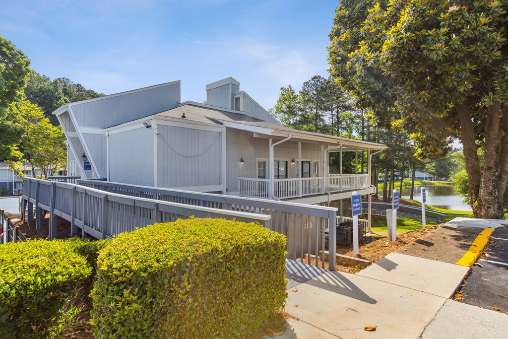 a house with a dock next to a body of water