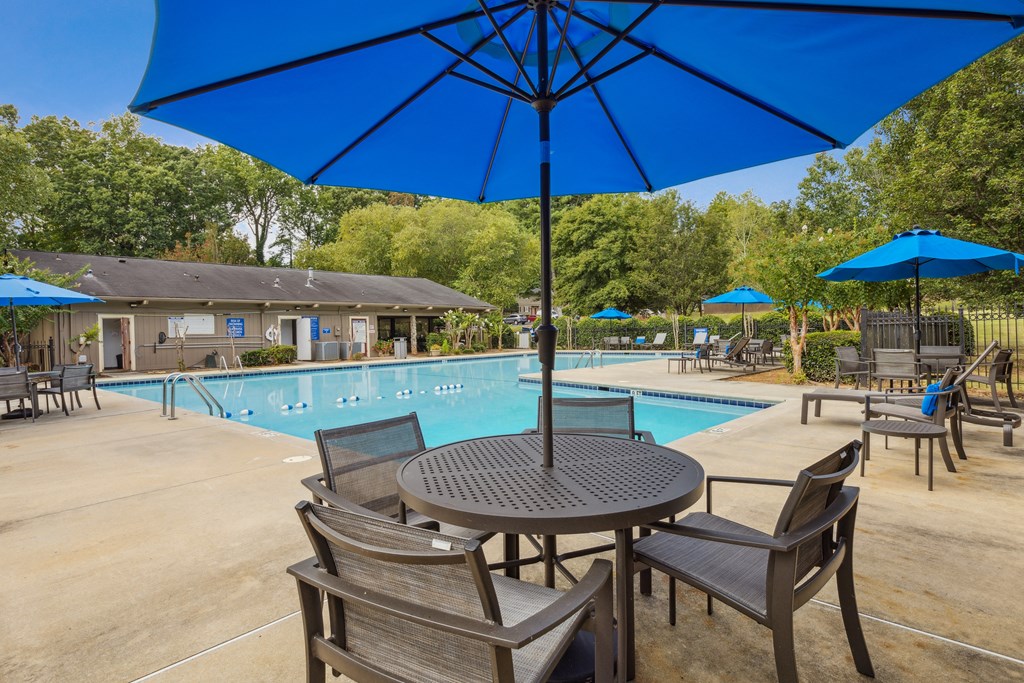 our apartments have a swimming pool and tables with umbrellas