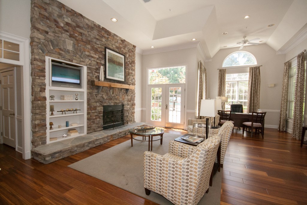 a large living room with a stone fireplace and a couch