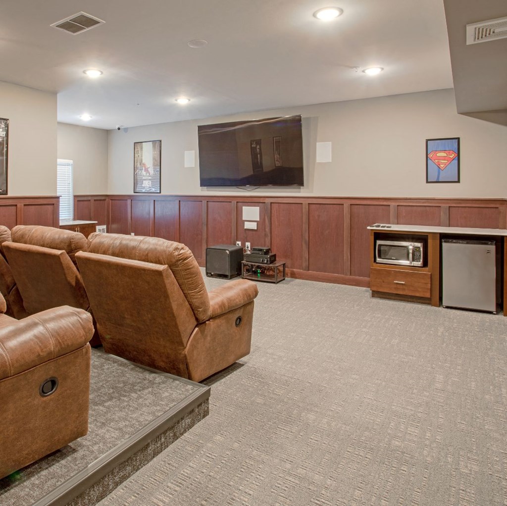 a large living room with couches and a television