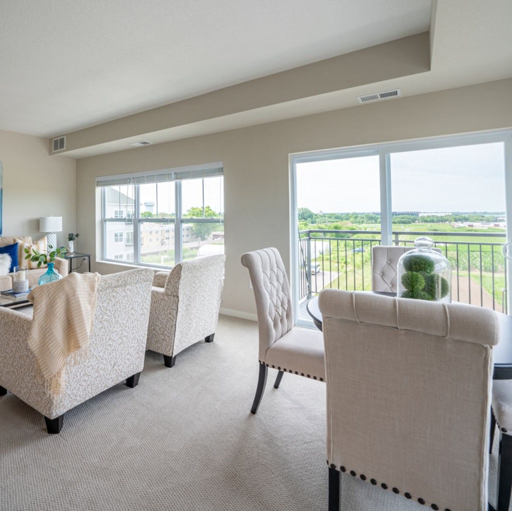 a living room with couches and chairs and a table