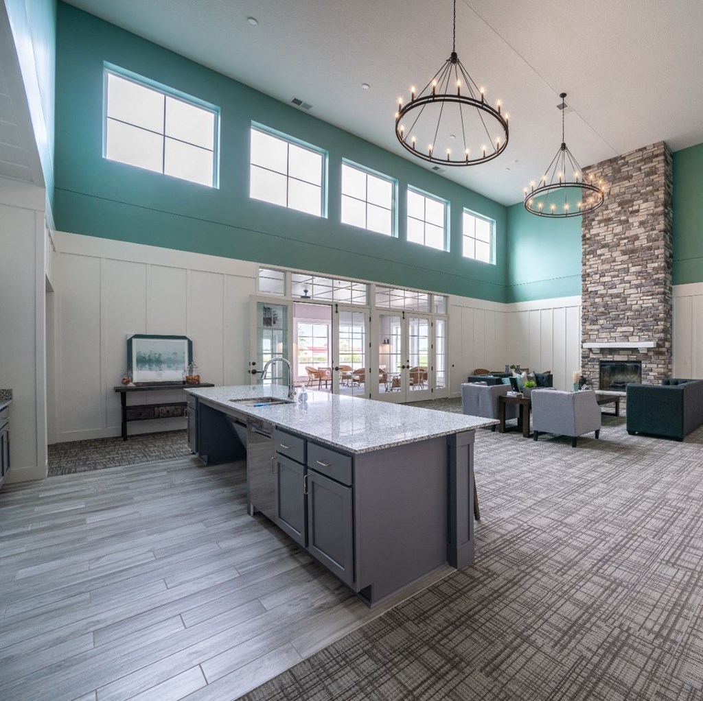 a large room with a counter top in the middle of it