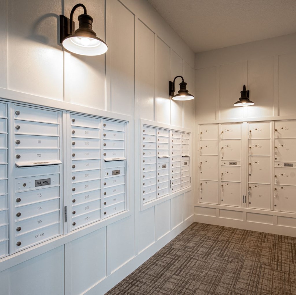 a laundry room with blue cabinets and two lights