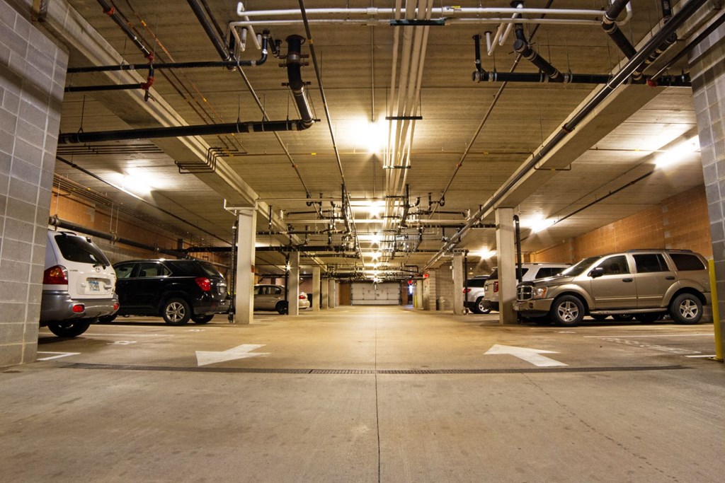 a parking garage with cars parked in it