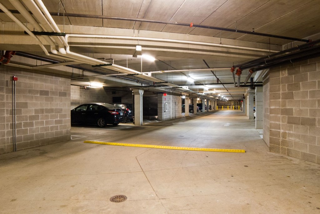 the inside of a parking garage with cars in it