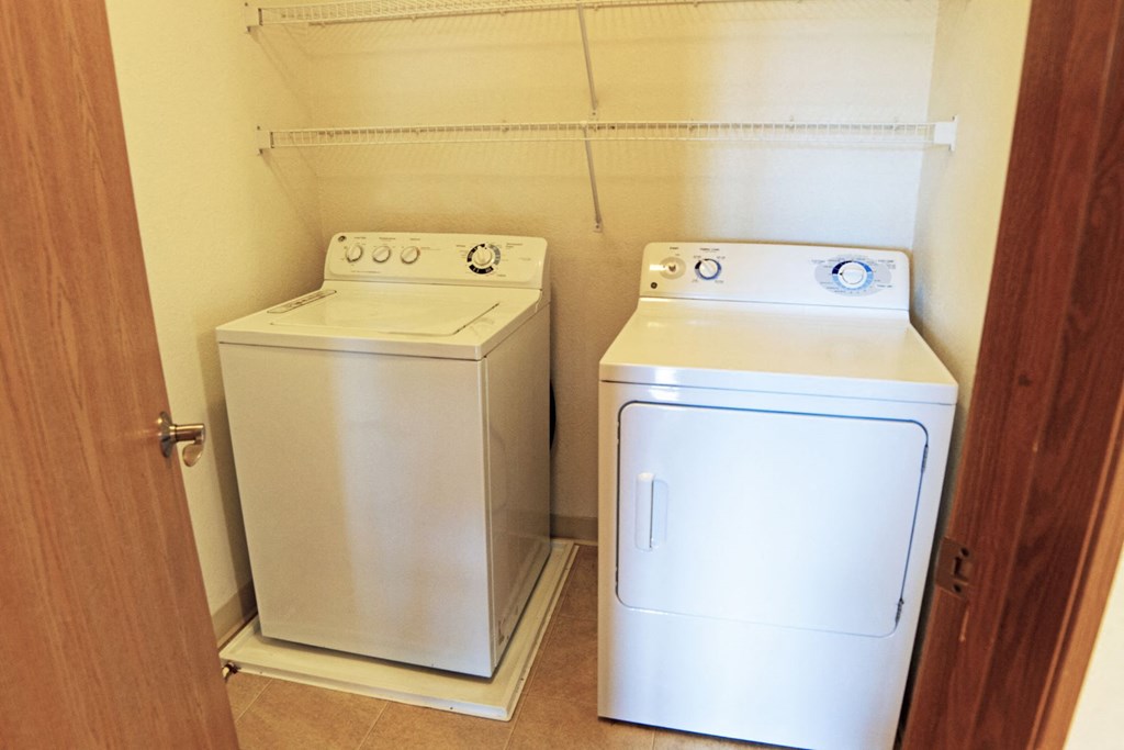 a laundry room with a washing machine and a dryer