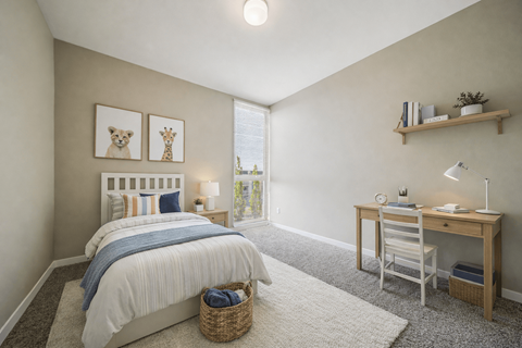 Bedroom with desk and natural light at Lofts at Innovation Center Apartments, Richland, WA 99354