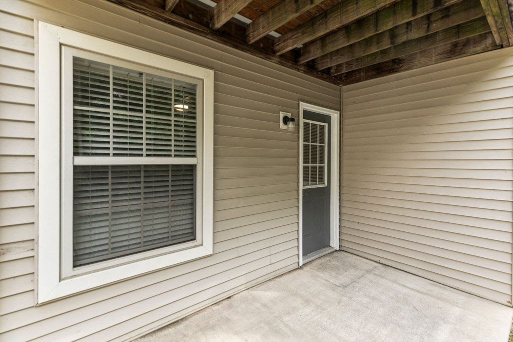 A small room with a door and a window.