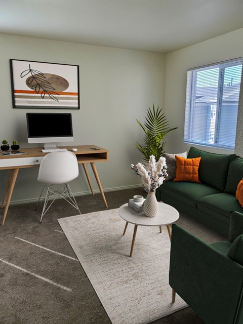 A modern living room with a green couch, a white desk, and a painting on the wall.