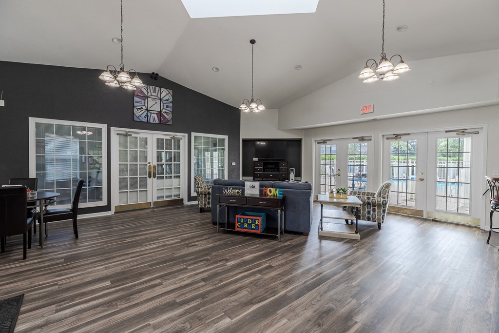 A room with wooden floors and a skylight.