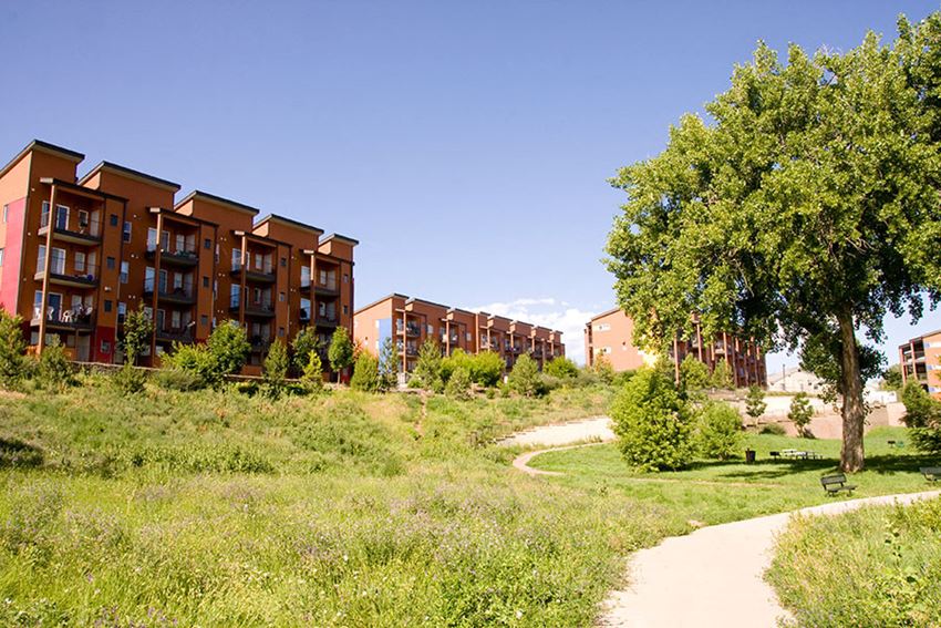 a path leading to a group of apartment buildings