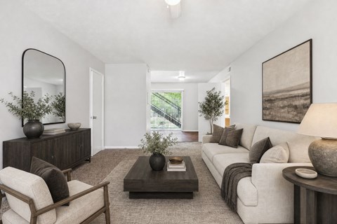 Living room with modern furniture and neutral decor at Stratford Arms Apartments, Riverdale