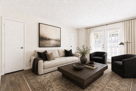 A living room with a couch, chair, and coffee table.