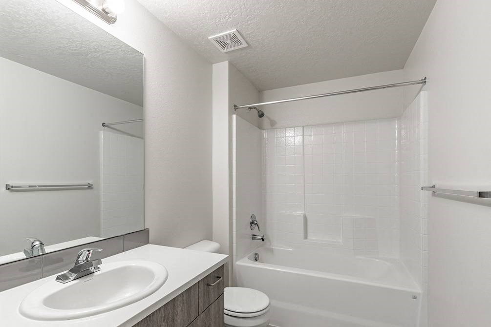 a bathroom with a sink toilet and bathtub